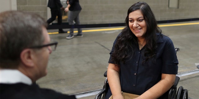 Tatev, who has lived in the U.S. for 17 years, went into labor before her U.S. citizenship ceremony and refused to go to hospital until she was sworn in as a U.S. citizen on Aug. 22, 2019.  (REUTERS/Lucy Nicholson)
