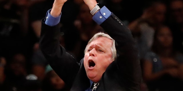 Seattle Storm head coach Dan Hughes signals a time out during the fourth quarter of a WNBA basketball game against the New York Liberty, Sunday, Aug. 11, 2019, in New York. The Storm defeated the Liberty 84-69.(AP Photo/Kathy Willens)