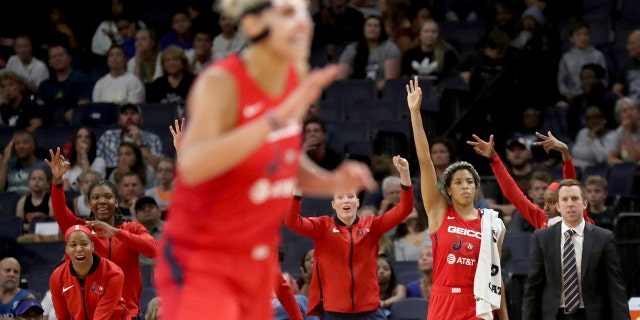 The Washington Mystics' bench celebrates a 3-point basket in the final minute of the team's 86-79 win over the Minnesota Lynx during a WNBA basketball game Friday, Aug. 16, 2019, in Minneapolis. (David Joles/Star Tribune via AP)