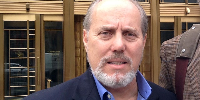 Ben Sprecher appears outside federal court after swindler Mark Hotton was sentenced to 31 months in federal prison in October 2014. Hotton conned $65,000 from the producers of "Rebecca; The Musical" into thinking he'd found them the millionaire investors who could help them open the show on Broadway. Sprecher has now been charged with possession and distribution of child pornography.