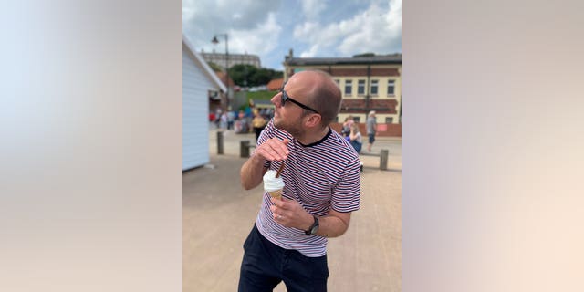 Phil Grant protecting his second ice cream after the attack.