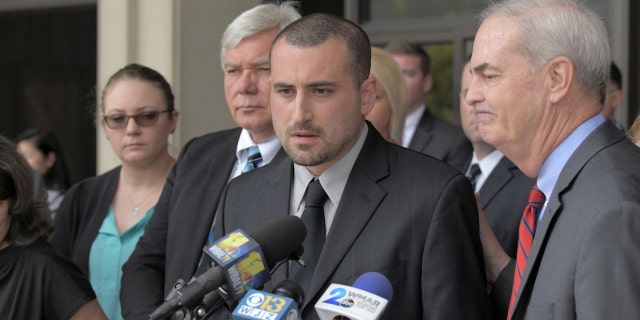 Widower Tim Caprio speaks, between father in-law Garry Sorrells, left, and Baltimore County State's Attorney Scott Shellenberger following the life sentence meted out for 17-year-old Dawnta Harris at Baltimore County Circuit Court Wednesday, Aug. 21, 2019, in Towson, Md.(Karl Merton Ferron/The Baltimore Sun via AP)