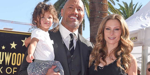 Dwayne "The Rock" Johnson, Lauren Hashian and daughter Jasmine Johnson attend the ceremony honoring the former WWE Superstar-turned-A-lister with a star on the Hollywood Walk of Fame on Dec. 13, 2017 in Hollywood. Johnson and Hashian, who also share daughter Tiana, married on Aug. 18, 2019 in Hawaii.