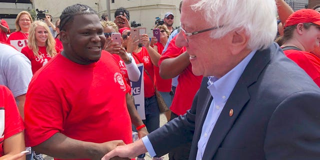 Sanders spoke to the striking telecommunications workers before attending his rally in Louisville. (AP Photo/Bruce Schreiner)