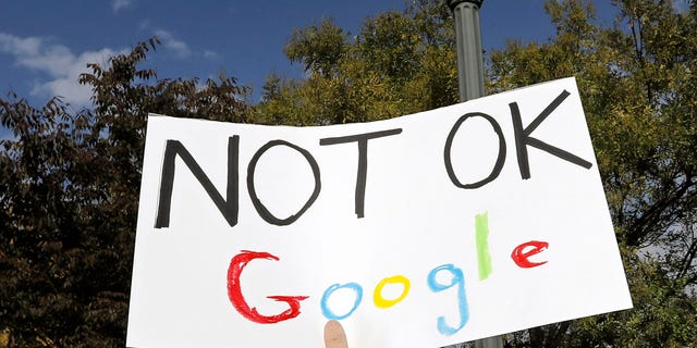 A Google employee holds a sign during a walkout to protest how the tech giant handled sexual misconduct at Jackson Square Park in New York, U.S., Thursday, Nov. 1, 2018.