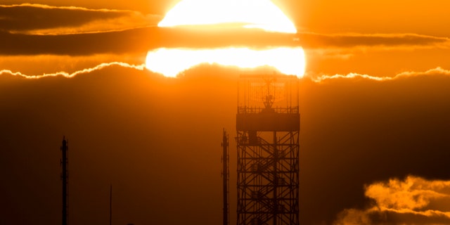 The radar tower of Tegel Airport is pictured in front of the setting sun on March 19, 2019, in Berlin, Germany.