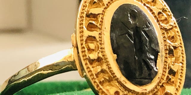 The ring bears a Latin inscription. (SWNS)
