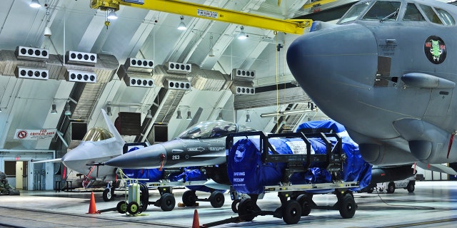Airmen of the 36th Wing, and Marines of the Aircraft Group 12 from Marine Corps Air Station Iwakuni, Japan, work together to store aircraft inside the hangars at Andersen Air Base, Guam. (U.S. Air Force photo by Staff Sgt. Alexnadre Montes)