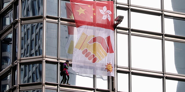 French urban climber Alain Robert climbs the Cheung Kong Center building in Hong Kong, China, August 16, 2019.