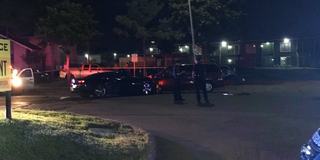 Houston police released the following image of a crime scene where a man was pinned between two cars after attempting to stop a carjacker from making off with a vehicle with his wife still inside.