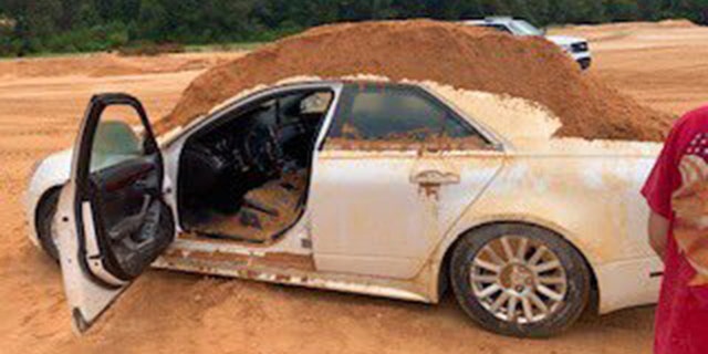A Florida man dumped dirt on his girlfriend's borrowed Cadillac.