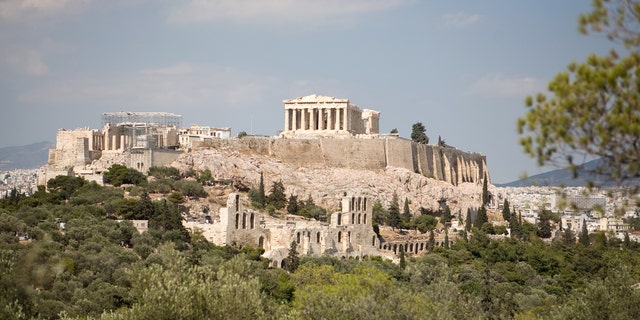 Adebola Sowemimo was visiting the Acropolis of Athens when she said she was pushed out of a museum building and accused of lifting up her skirt and flashing other tourists.
