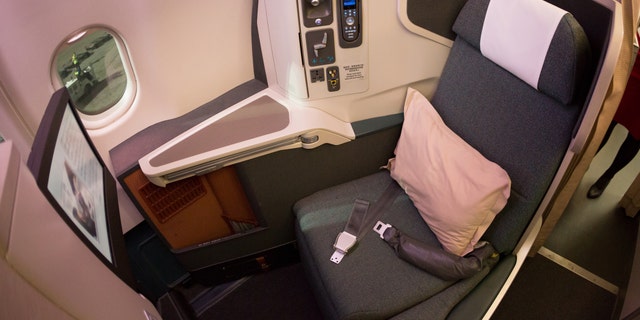 An interior shot of a Cathay Pacific Airbus A330-300, business class cabin.