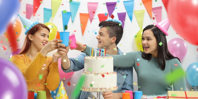 Cheerful teenagers celebrating a birthday. "Perceived social support" is associated with a variety of health benefits, according to new research. 