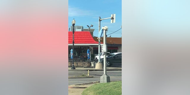 A creepy doll hanging from a light pole in Festus, Missouri.
