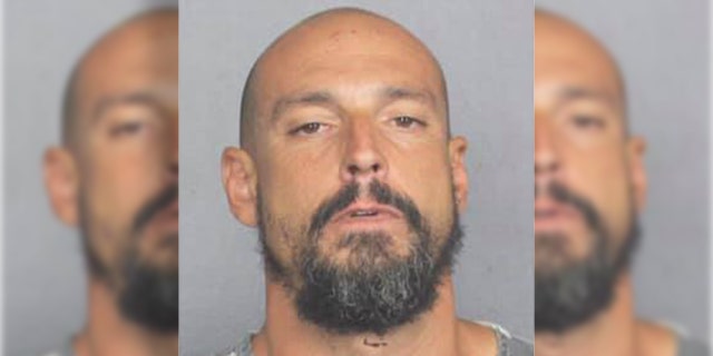 Mugshot for "John Smith," a man who refused to divulge his name after police accused him of pedaling a bike around Wilton Manners, Fla., in the nude, before stealing underwear.