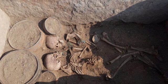 The bodies of a young man and woman inside the grave. The cemetery dates back approximately 4,000 years to the Bronze Age. (Credit: Karaganda regional government)