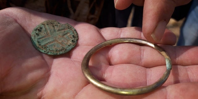 Some of the jewelry and bracelets that were found that belonged to the young man and woman. (Credit: Karaganda regional government)