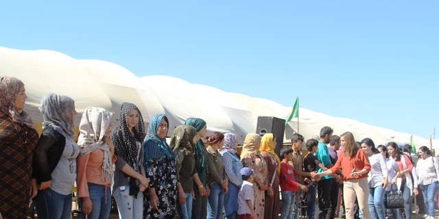 Kurdish women in their protest human shield in Syria