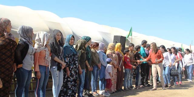 Kurdish women in their protest human shield in Syria