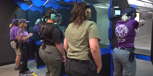 Members of the Well Armed Woman practice shooting at C2 Tactical, in Scottsdale Arizona.