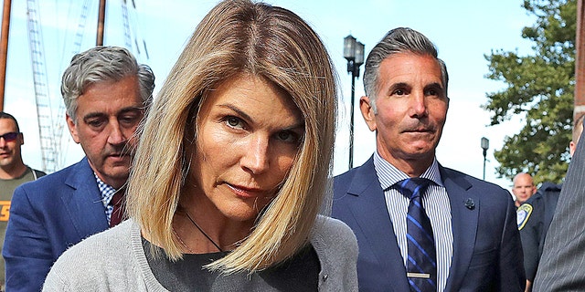 Lori Loughlin and her husband Mossimo Giannulli leave the John Joseph Moakley courthouse in Boston on August 27, 2019. Giannulli, 57, is currently serving his five-month prison sentence in Lompoc, California.