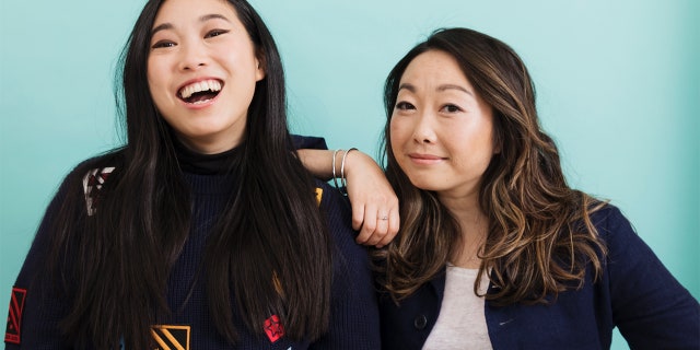Lulu Wang and actress Awkwafina pose in New York to promote their film, "The Farewell."