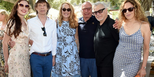 From l-r: Elizabeth Jagger, Mick Jagger, Jerry Murdoch, Executive Chairman News Corp. & Co-Chairman Fox Corporation Rupert Murdoch, Harvey Keitel, and Daphne Kastner attend a BBQ lunch in the vineyard “Celebrating Thirty Years of Moraga Bel Air” hosted by Jerry and Rupert Murdoch on Aug. 25, 2019 in Bel Air, California.