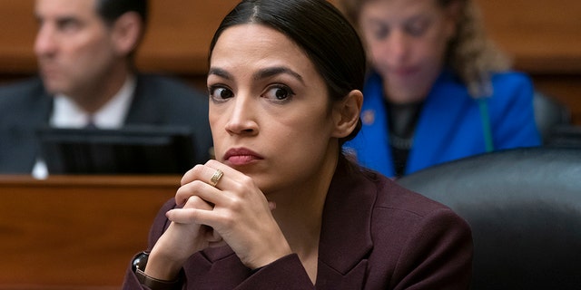 Rep. Alexandria Ocasio-Cortez, D-N.Y., listens to questioning of Michael Cohen, President Donald Trump's former personal lawyer, at the House Oversight and Reform Committee, on Capitol Hill in Washington, Wednesday, Feb. 27, 2019. (AP Photo/J. Scott Applewhite)