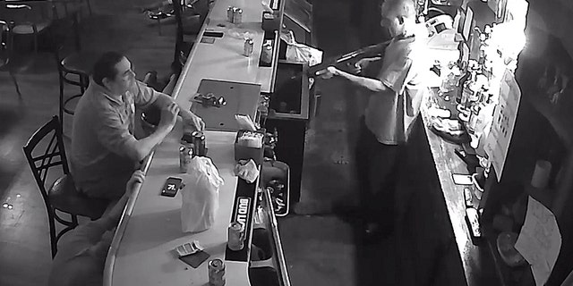 Tony Tovar lit a cigarette as Behrmann's Tavern was robbed Wednesday by a man with a weapon.