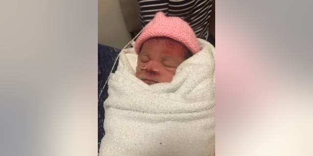 Amber Woollard's baby Valenci shortly after birth. (SWNS)