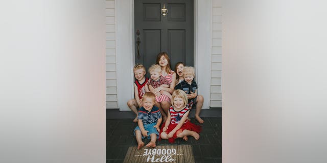 The twins with their older siblings. (SWNS)