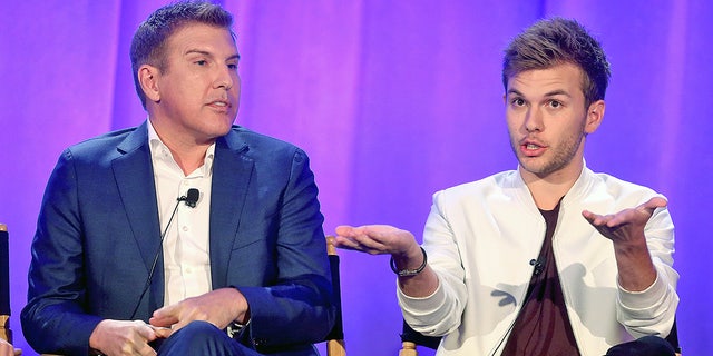 Producer/TV personality Todd Chrisley and son Chase Chrisley speak onstage during the "Chrisley Knows Best" panel at the 2016 NBCUniversal Summer Press Day on April 1, 2016. Todd was indicted on federal tax evasion charges, while son Chase was slapped with a $  16,886 tax lien.