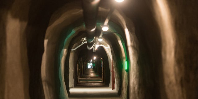 DARPA solicited information on underground lairs in a recent tweet. The above image shows the inside of the Barbara Tunnel in Oberried, Germany. The tunnel has been the central long-term archive of Germany since 1975.