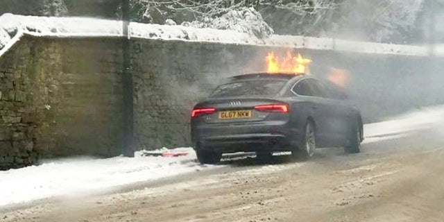 The man's car was set ablaze by the explosion. (SWNS)