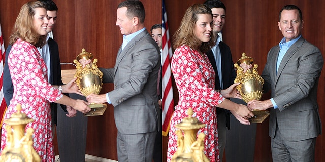 Two stunning vases stolen by the Nazis 80 years ago were returned to the heirs of their original owners at a ceremony in Berlin Thursday after a joint effort by the American embassy and an FBI art crime team. Pictured is US Ambassador Richard Grenell returning the art
