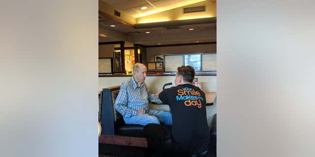 Lisa Meilander said at first her family didn't see the older man come in, but took notice when their waiter, Dylan Tetil, 24, got down on one knee to talk to the man “eye-to-eye.”