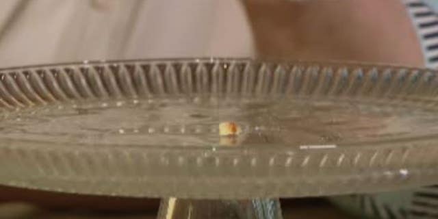 The once three-tiered vanilla cake with white frosting has been reduced to a small crumb after nearly half-a-century.