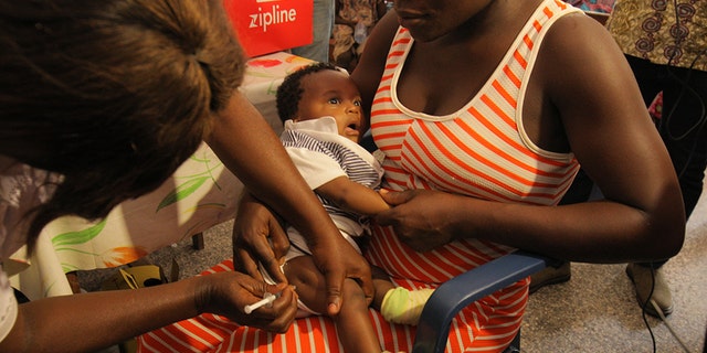 Child receiving Yellow fever vaccine delivered by Zipline drone at New Tafu Hospital, Ghana
