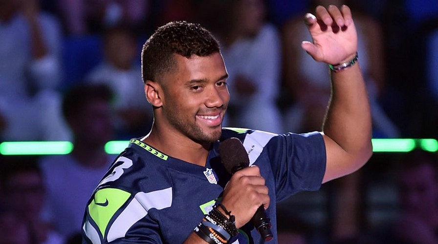 Quarterback Russell Wilson gives offensive line $156K worth of Amazon stock