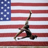 Simone Biles competes on the beam during the senior women's competition at the 2019 U.S. Gymnastics Championships in Kansas City, Aug. 11, 2019. 