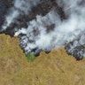 Smoke rises over a deforested plot of the Amazon jungle in Porto Velho, Rondonia State, Brazil, Aug. 24, 2019. 