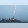 One World Trade Center is hit by a lightning bolt during a thunderstorm in New York City, Aug. 7, 2019.