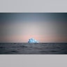 A large Iceberg floats away as the sun sets near Kulusuk, Greenland, Aug. 15, 2019.