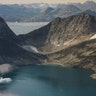 Icebergs are photographed from the window of an airplane carrying NASA Scientists as they fly on a mission to track melting ice in eastern Greenland, Aug. 14, 2019