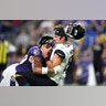 Baltimore Ravens Kenny Young sacks Jacksonville Jaguars quarterback Gardner Minshew during the first half of an NFL football preseason game in Baltimore, Aug. 8, 2019. 