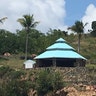 A circular stone structure and turquoise-blue roof is said to be an outdoor massage center on Jeffrey Epstein's Little St. James Island. 