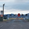 In this July 22, 2019 file photo, signs warn about trespassing at an entrance to the Nevada Test and Training Range near Area 51 outside of Rachel, Nev.