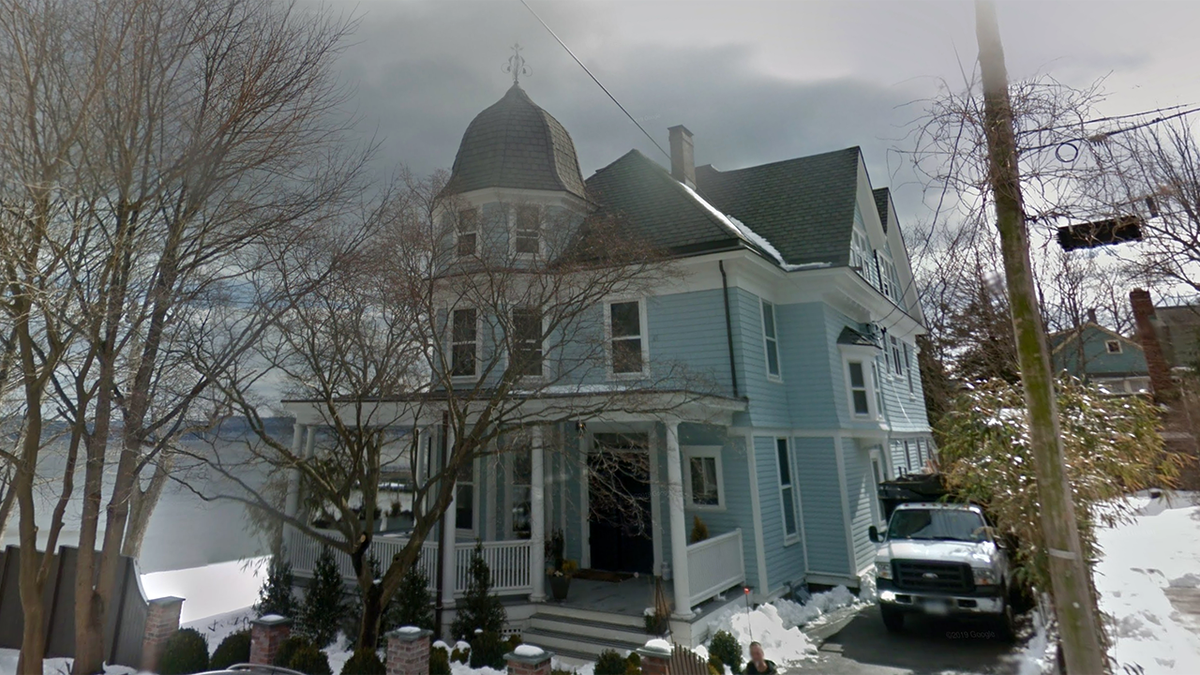 Blue three-story home