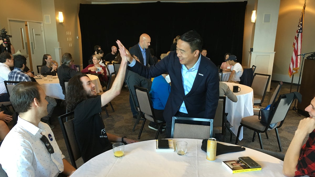 Democratic presidential candidate Andrew Yang greets audience members at a chamber of commerce event in Portsmouth, N.H., on Sept. 27, 2019